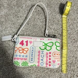 Coach White Wristlet with Multicolor Logo Motifs